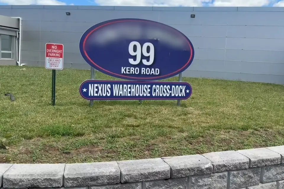 The entrance sign at 99 Kero Rd, Carlstadt, New Jersey, with the panel Nexus Warehouse Cross-Dock